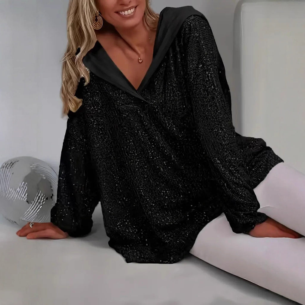 Hoodie oversize femme à sequins brillants. Coupe ample confortable pour soirées ou casual chic.