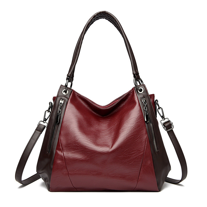 Sac tote versatile en cuir doux minimaliste.