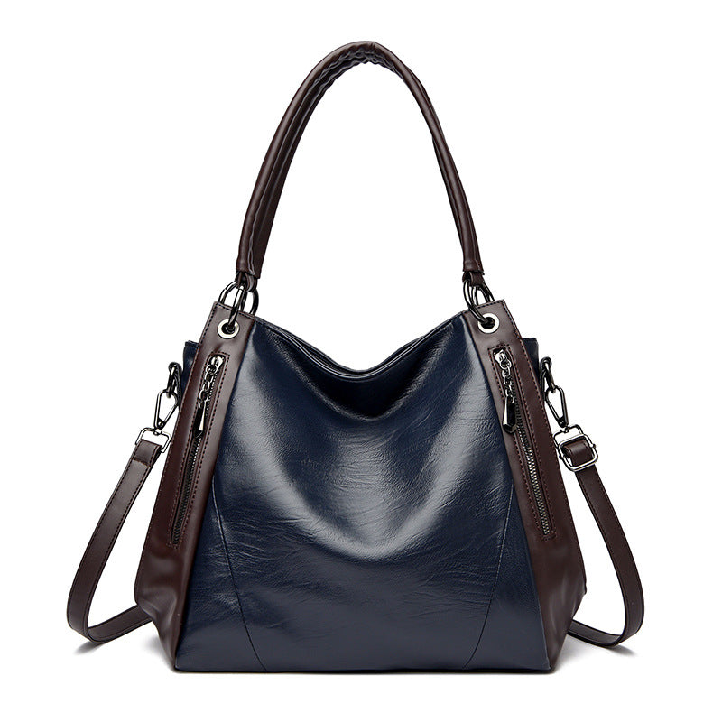 Sac tote versatile en cuir doux minimaliste.