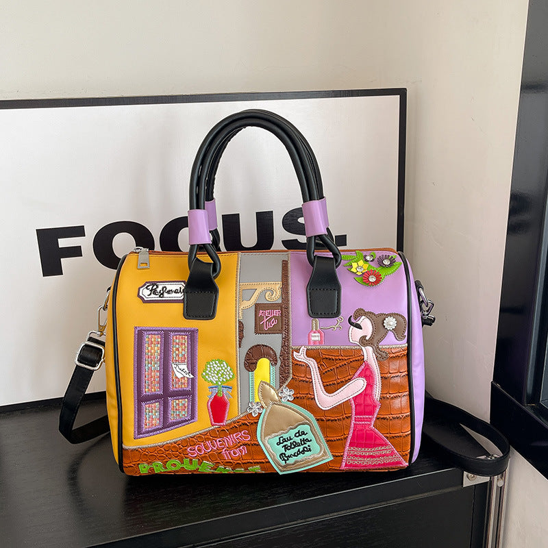 Sac Boston luxe grande contenance avec patchwork brodé artisanal.