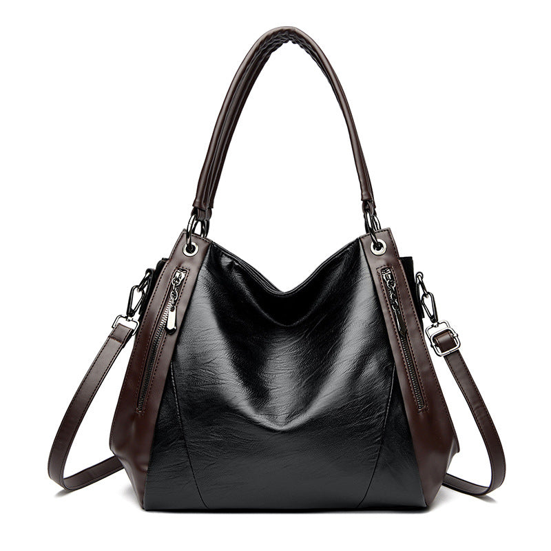 Sac tote versatile en cuir doux minimaliste.