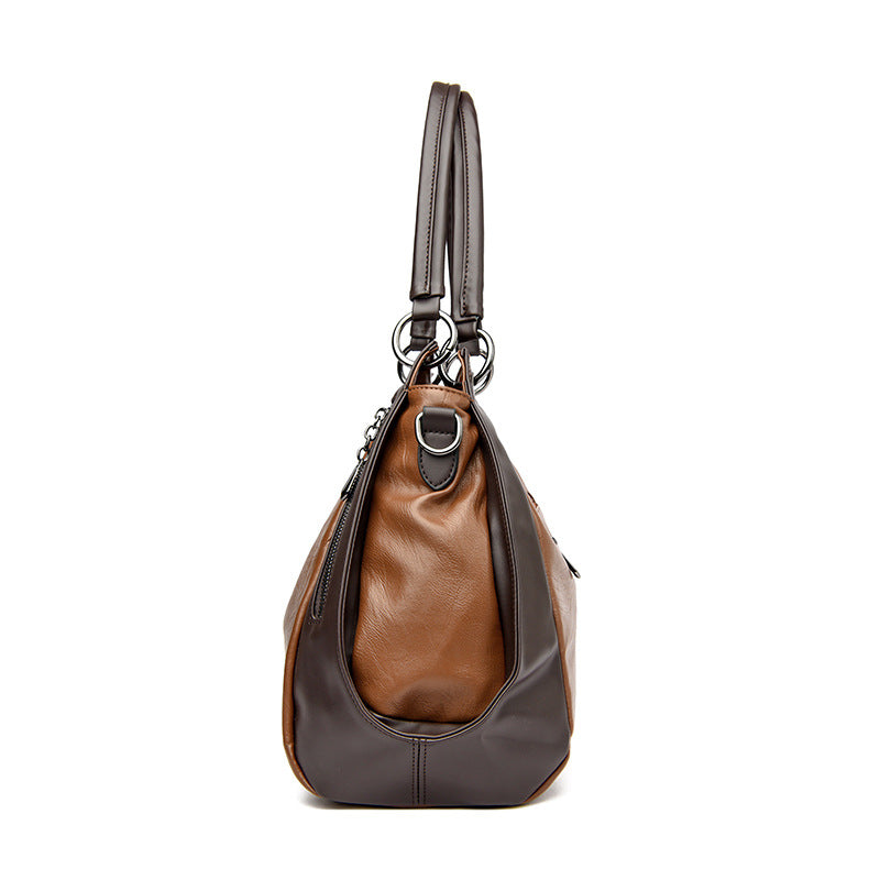 Sac tote versatile en cuir doux minimaliste.