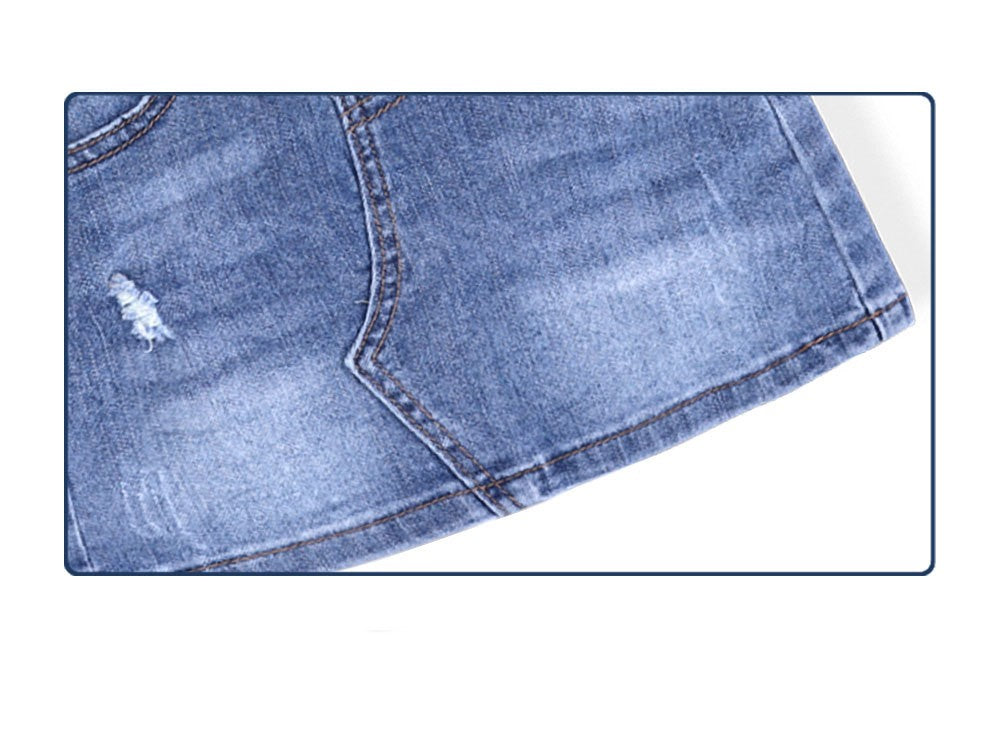 Jupe salopette en denim stretch déchiré fille