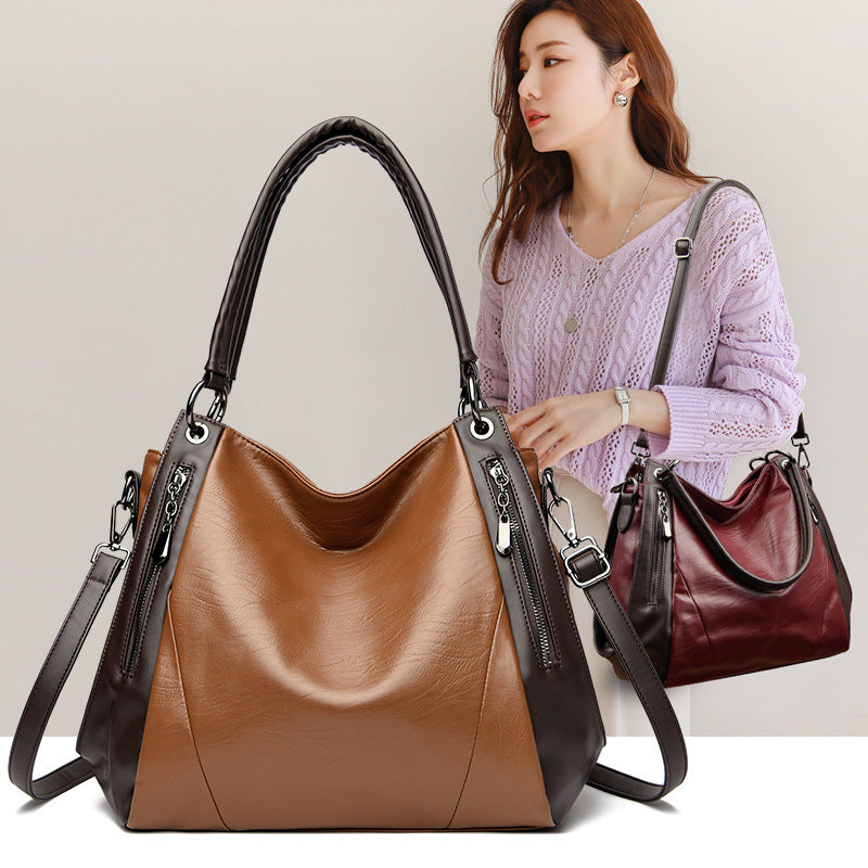 Sac tote versatile en cuir doux minimaliste.