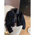 Blazer patchwork simili suède noir, coupe courte tendance femme.