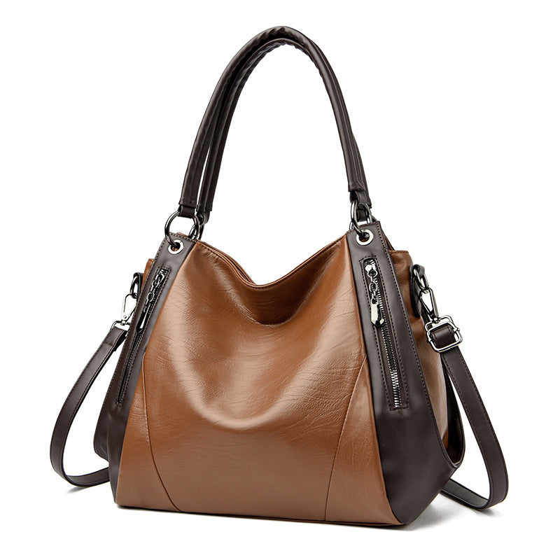 Sac tote versatile en cuir doux minimaliste.