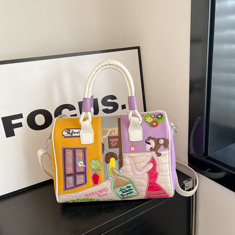 Sac Boston luxe grande contenance avec patchwork brodé artisanal.