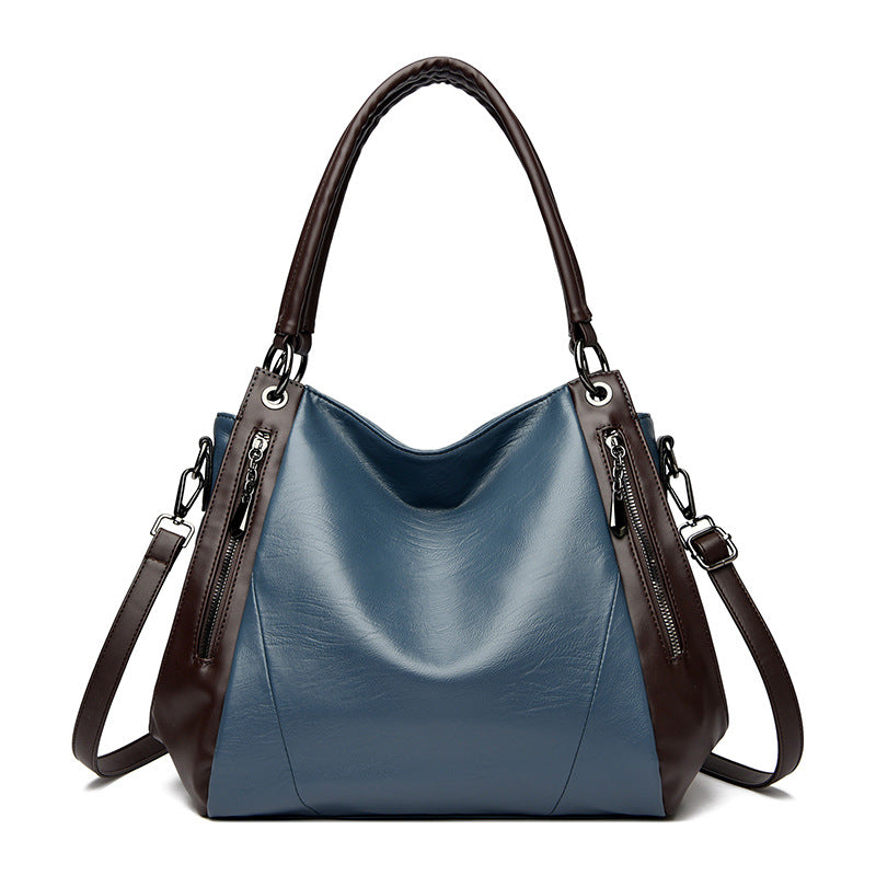 Sac tote versatile en cuir doux minimaliste.