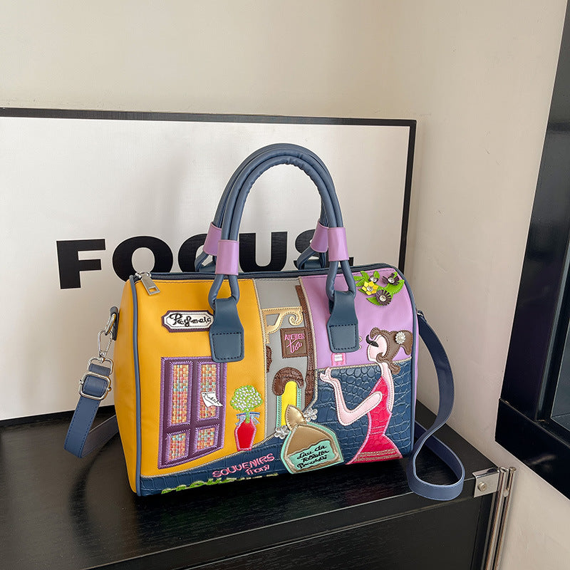 Sac Boston luxe grande contenance avec patchwork brodé artisanal.