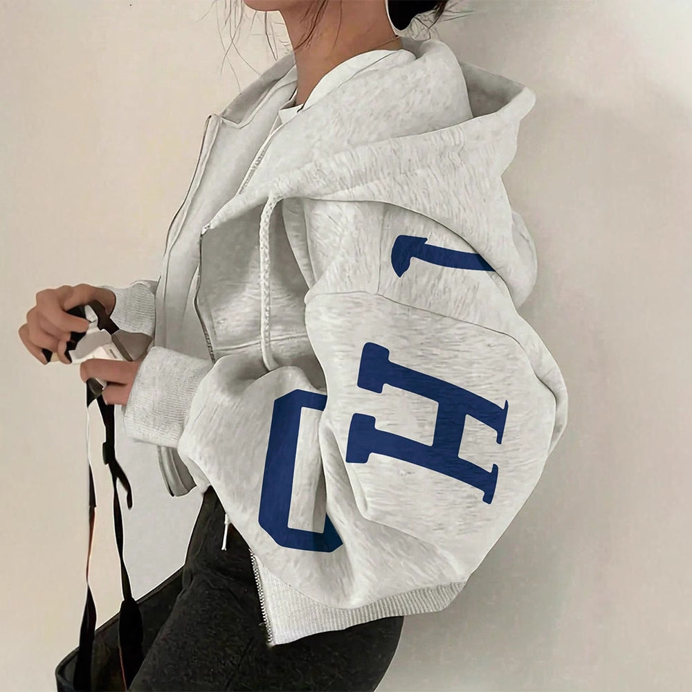 Sudadera casual con cremallera y mangas largas estampada, estilo relajado y moderno.