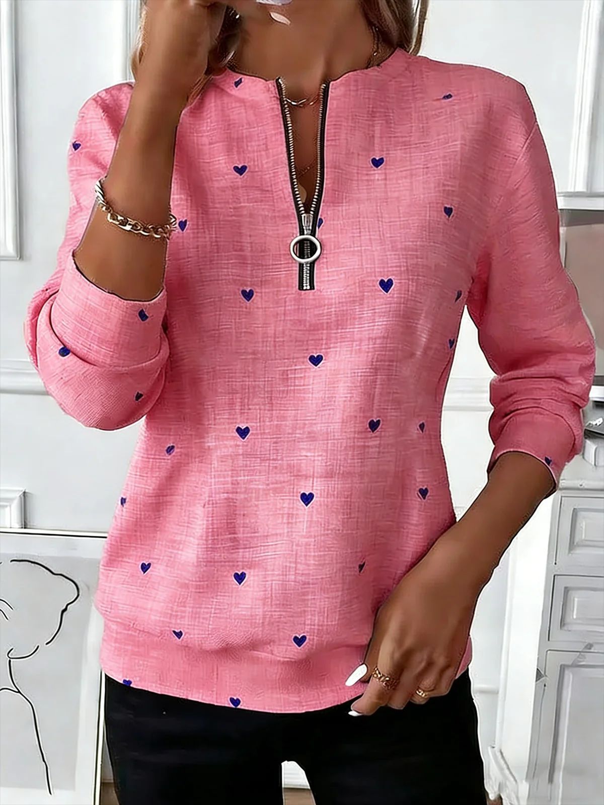 Women's long-sleeve pullover sweatshirt with festive trendy patterns.