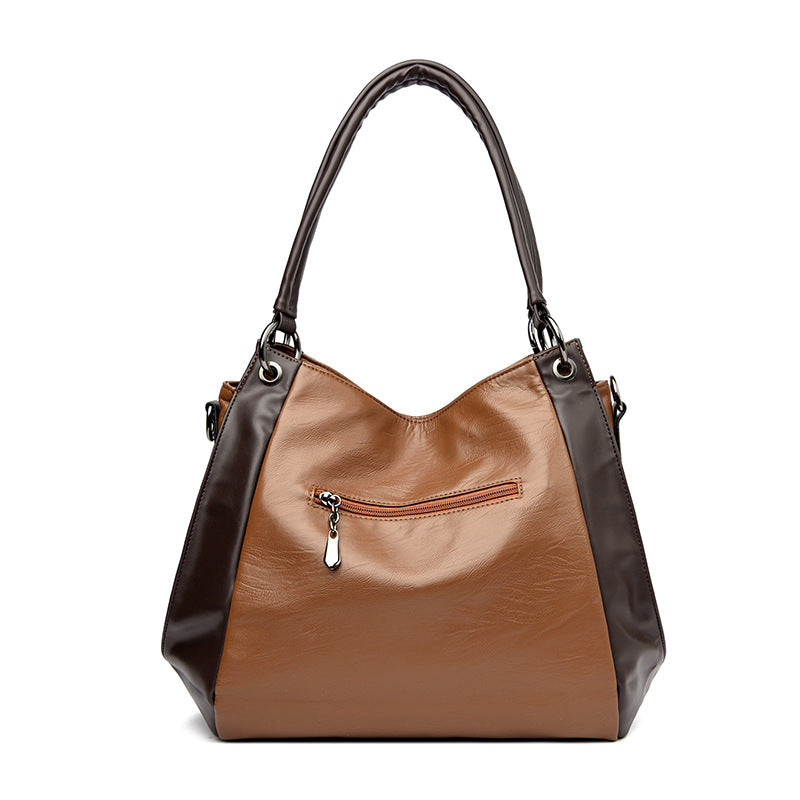 Sac tote versatile en cuir doux minimaliste.