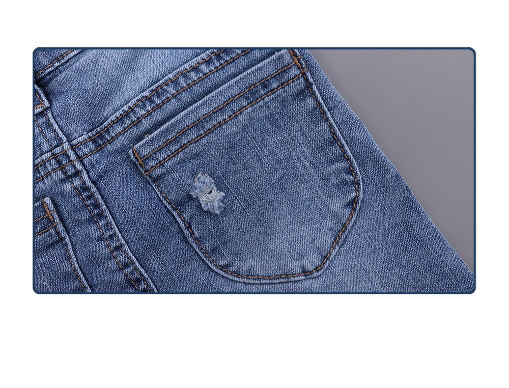 Jupe salopette en denim stretch déchiré fille