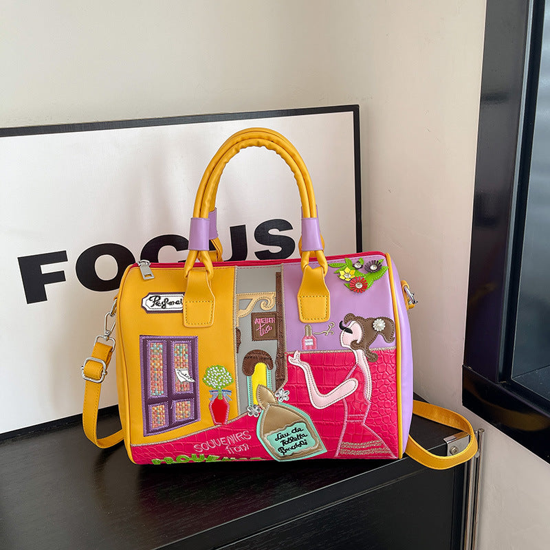 Sac Boston luxe grande contenance avec patchwork brodé artisanal.