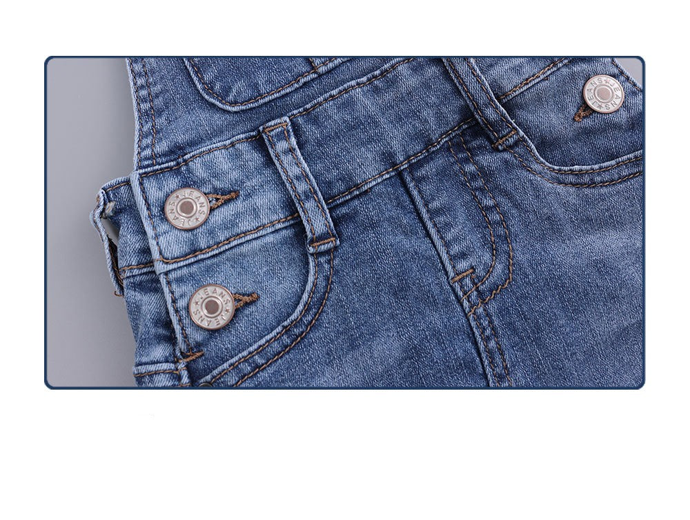 Jupe salopette en denim stretch déchiré fille