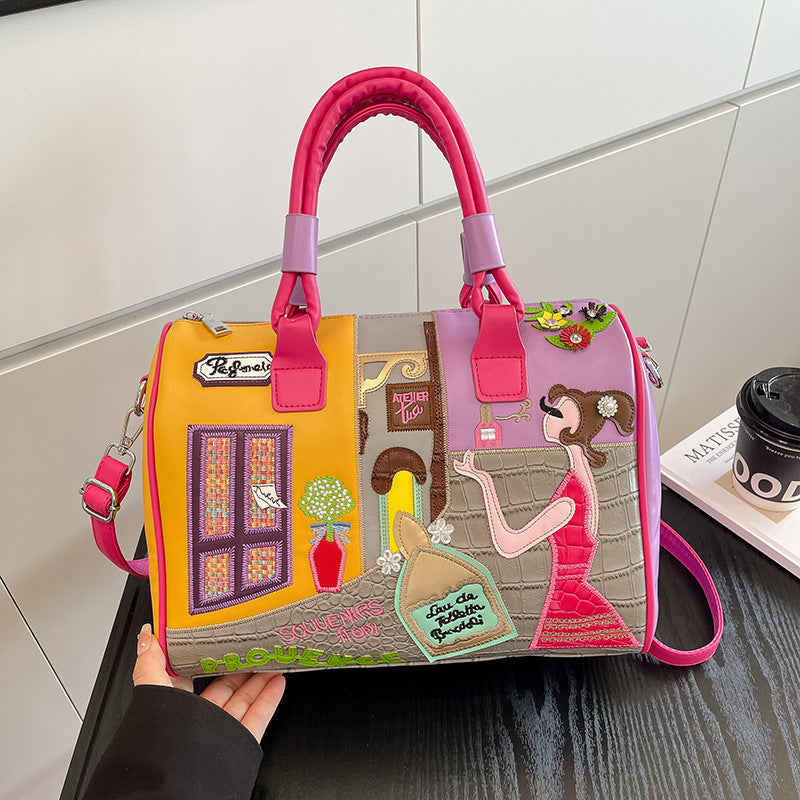 Sac Boston luxe grande contenance avec patchwork brodé artisanal.