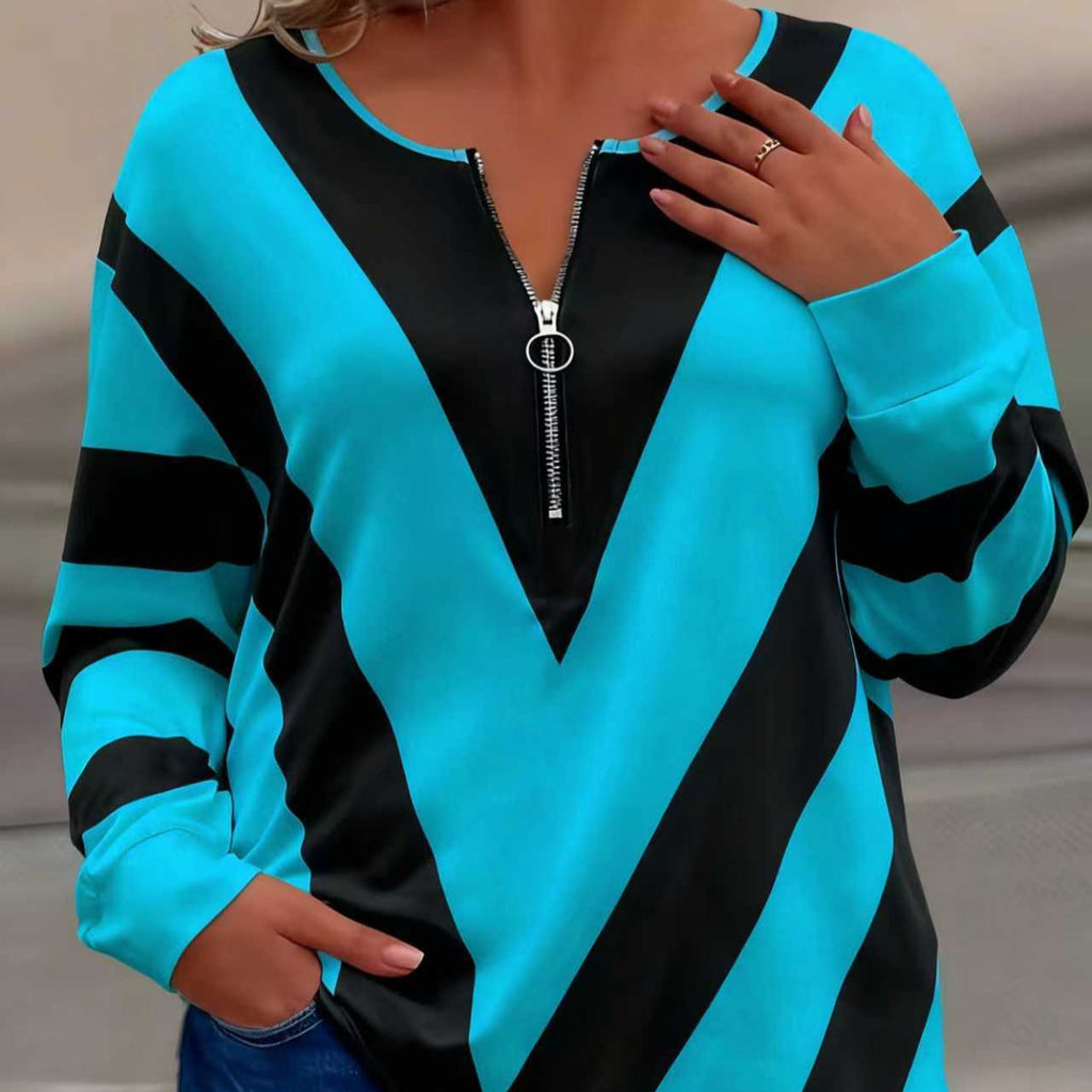 Camiseta color block com zíper, corte solto - casual e moderna.