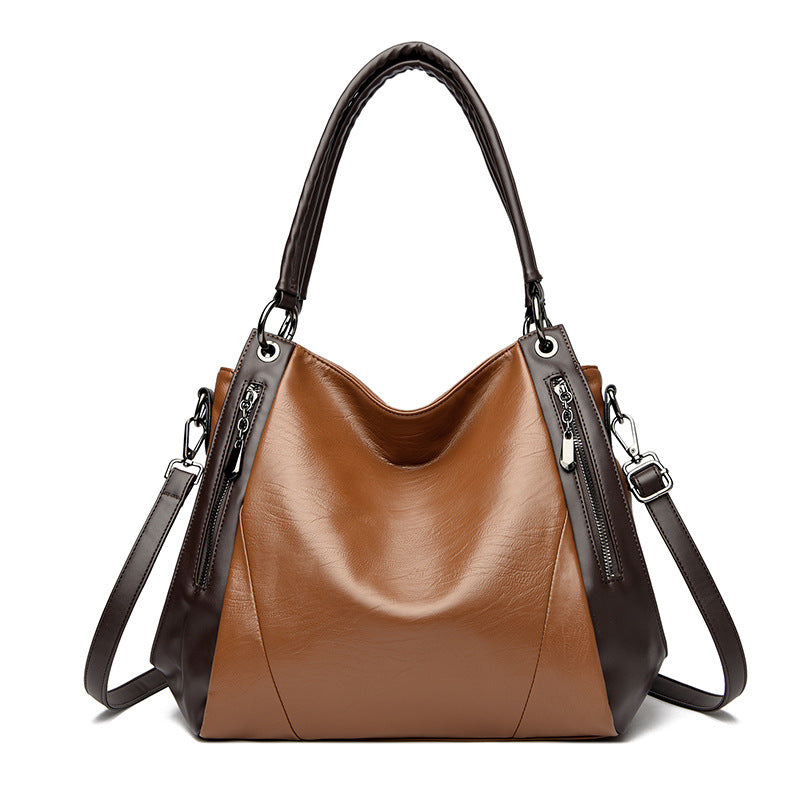 Sac tote versatile en cuir doux minimaliste.
