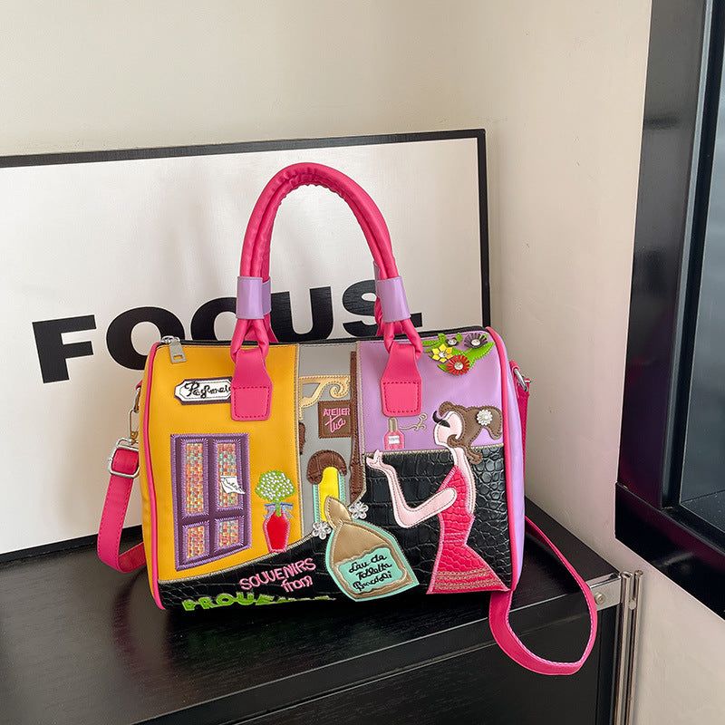 Sac Boston luxe grande contenance avec patchwork brodé artisanal.